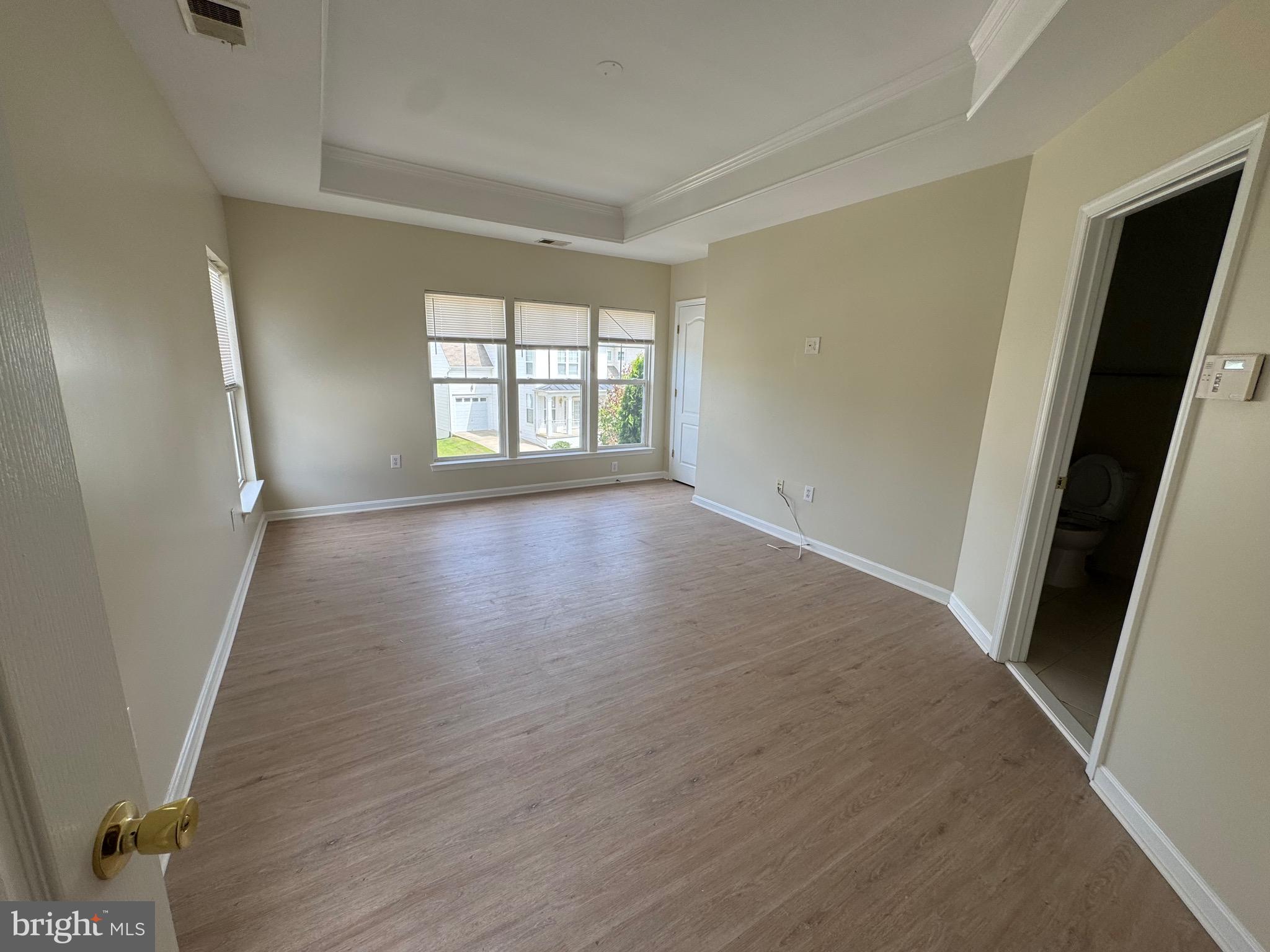 1905 Scaffold Way Odenton, MD 21113 - Photo 24 of 30 an empty room with wooden floor and windows