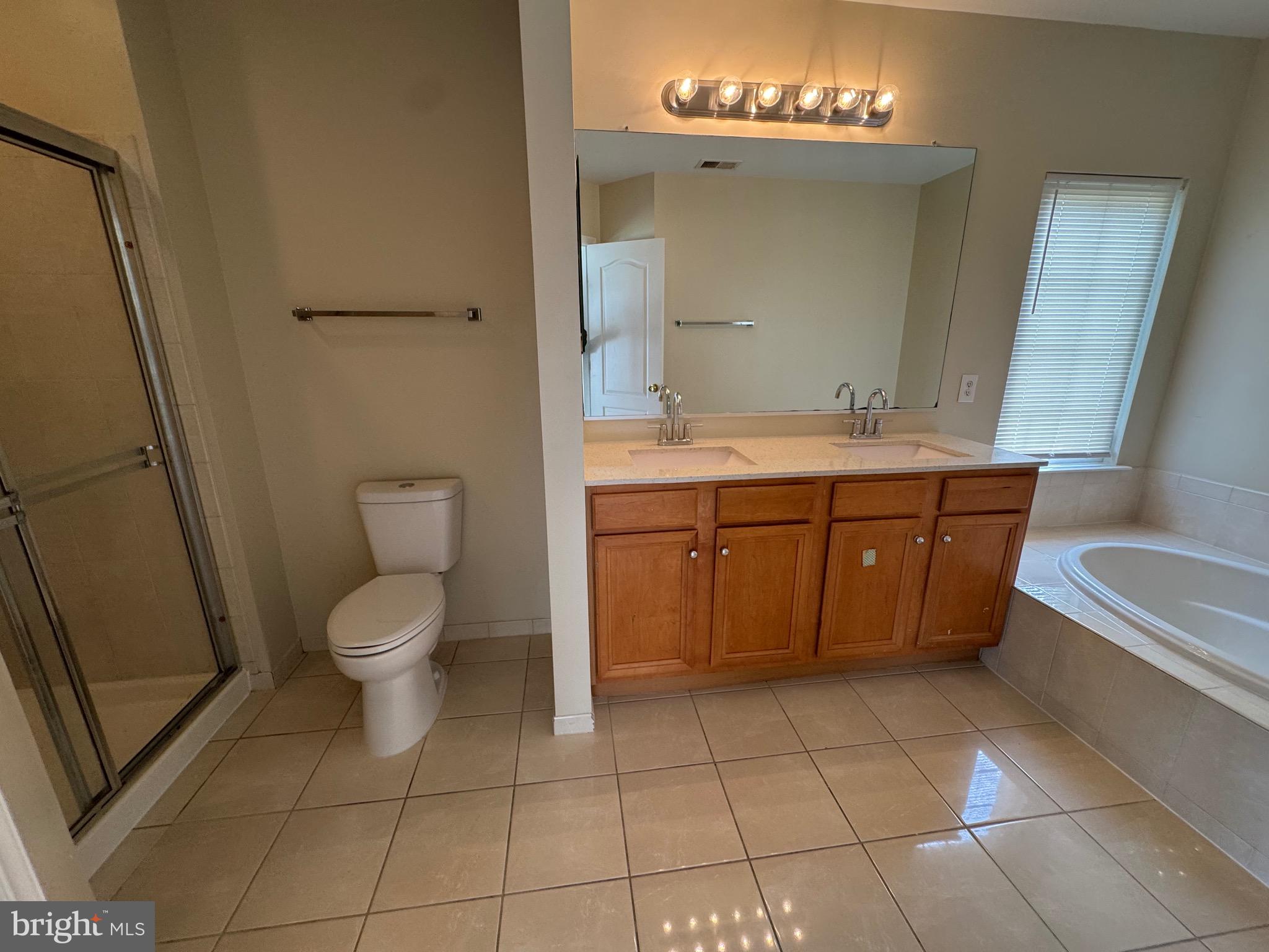 1905 Scaffold Way Odenton, MD 21113 - Photo 29 of 30 a spacious bathroom with a toilet sink and mirror