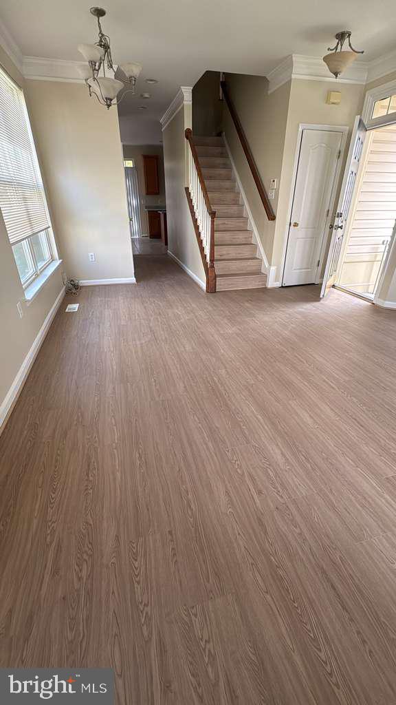 1905 Scaffold Way Odenton, MD 21113 - Photo 4 of 30 wooden floor in an empty room with a fireplace