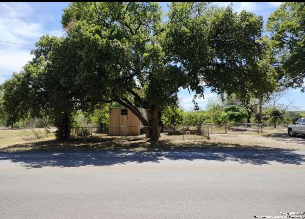 4605 Farm To Market Road 1518 Selma, TX 78154 - Photo 2 of 7 a street view with large trees