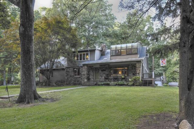 14 Wakefield Road Wilton, CT 06897 - Photo 1 of 1 a view of a big house with a big yard and large trees