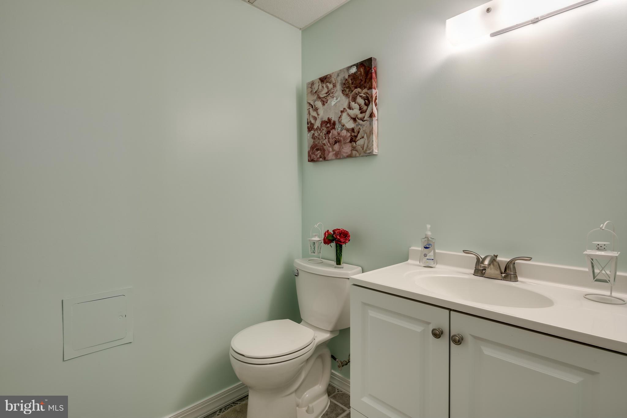 27 Robin Ridge Court Baltimore, MD 21234 - Photo 11 of 18 a bathroom with a sink mirror and toilet