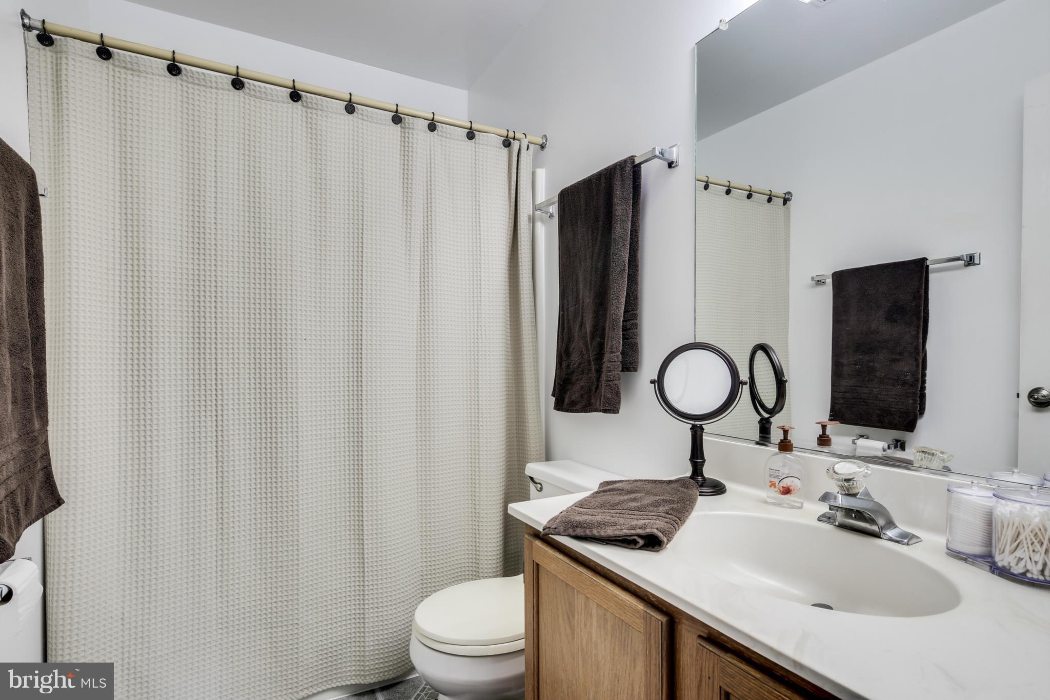 27 Robin Ridge Court Baltimore, MD 21234 - Photo 13 of 18 a bathroom with a sink toilet and shower