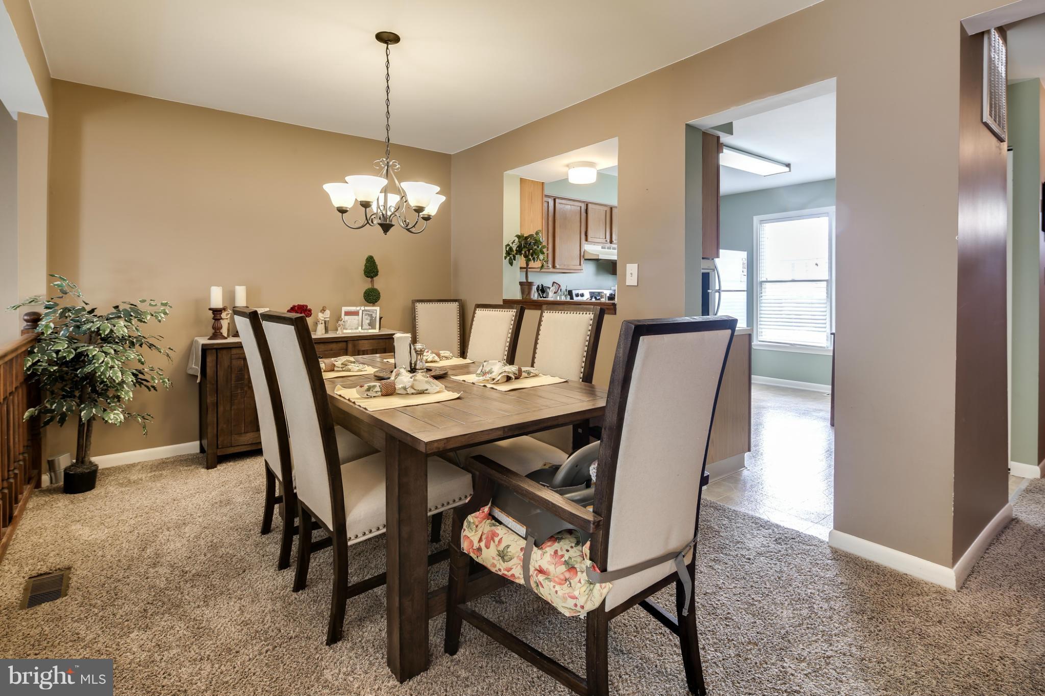 27 Robin Ridge Court Baltimore, MD 21234 - Photo 6 of 18 a dining room with furniture and chandelier