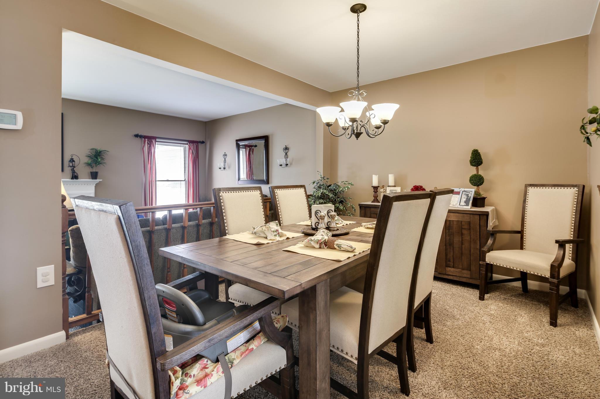 27 Robin Ridge Court Baltimore, MD 21234 - Photo 7 of 18 a view of a dining room with furniture and chandelier
