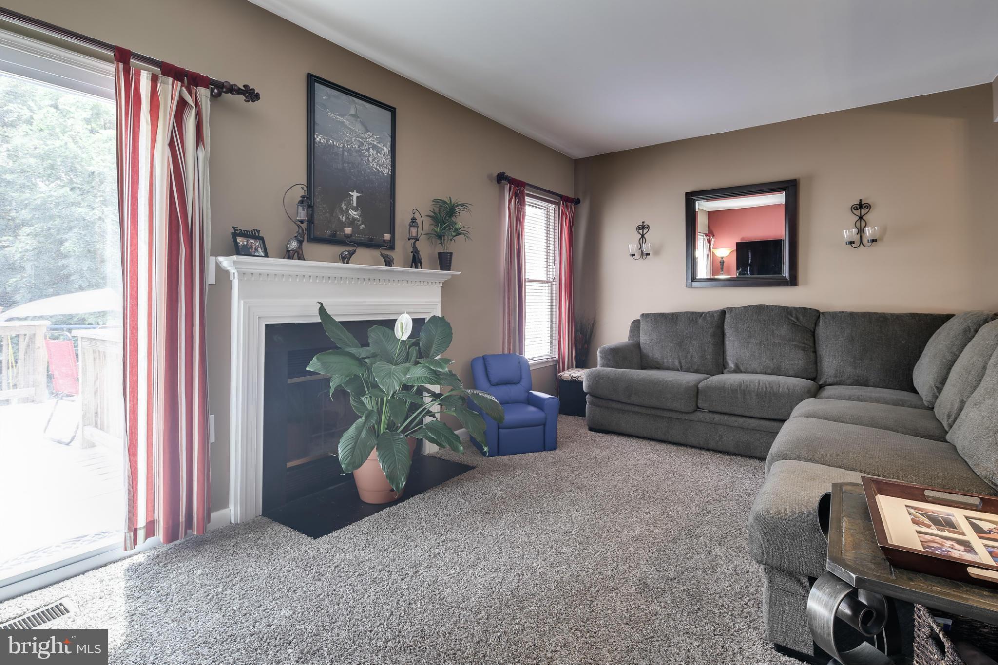 27 Robin Ridge Court Baltimore, MD 21234 - Photo 8 of 18 a living room with furniture a front door and a window
