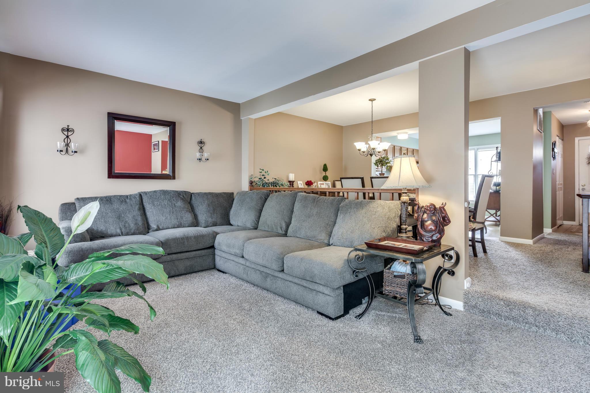 27 Robin Ridge Court Baltimore, MD 21234 - Photo 9 of 18 a living room with furniture and a potted plant
