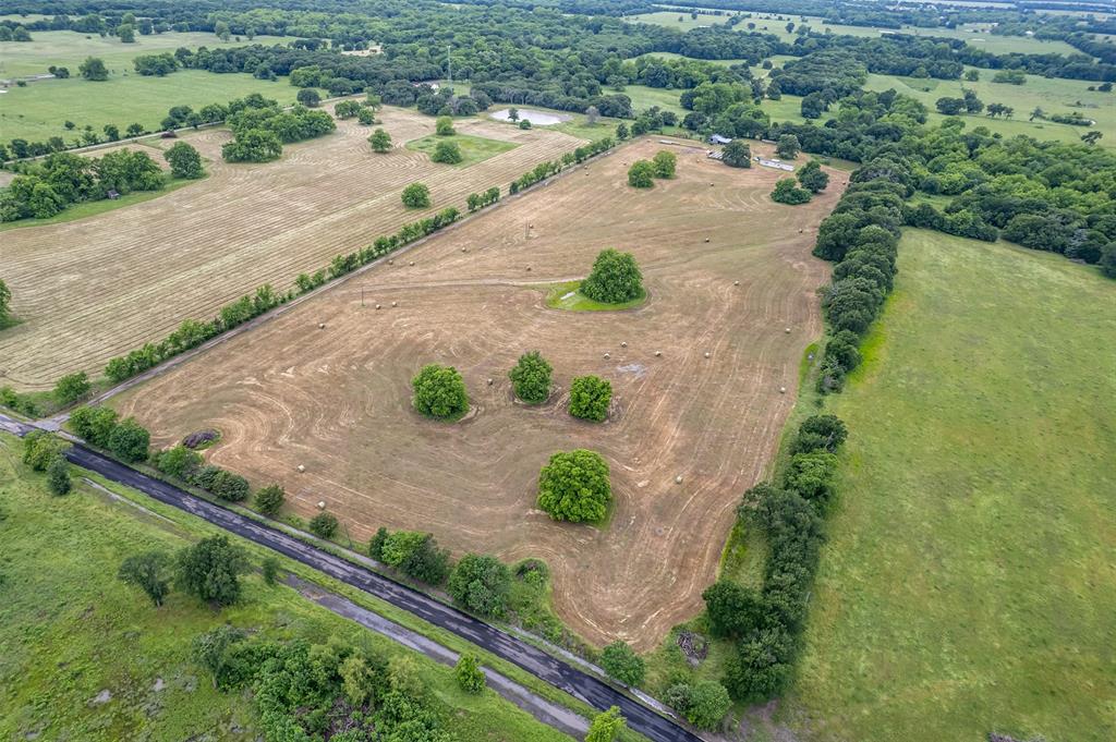 5286 County Road 4502 Commerce, TX 75428 - Photo 7 of 21 an aerial view of a house with a yard and lake view