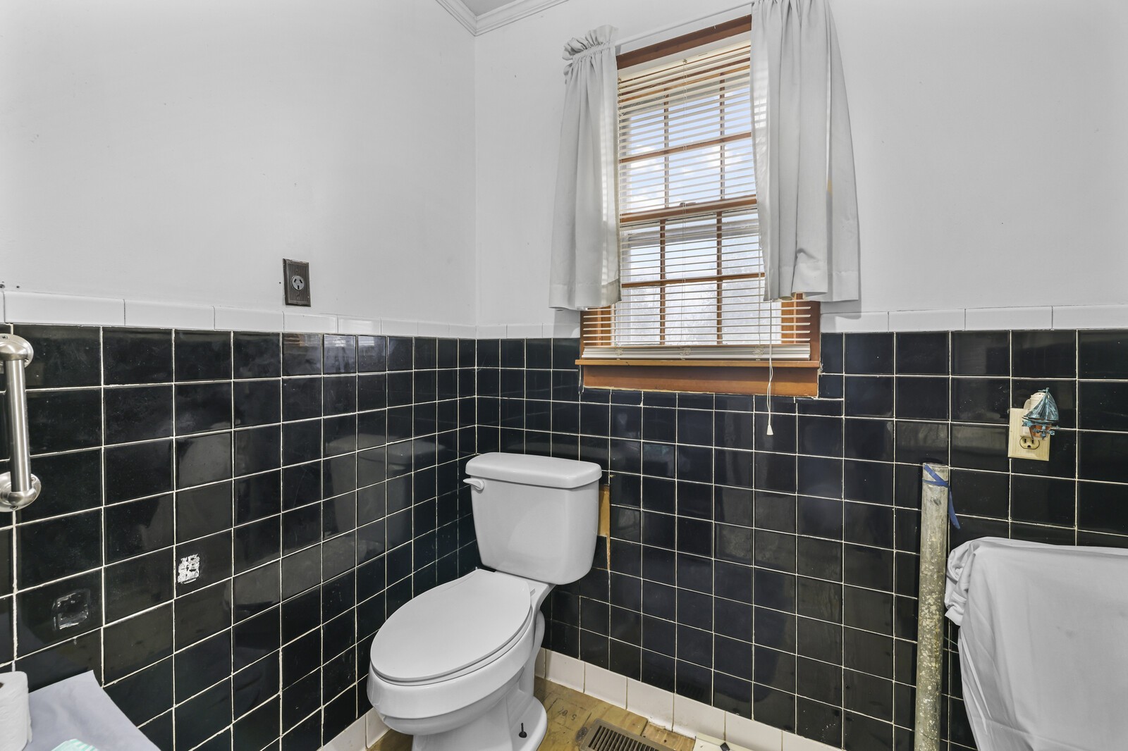 95 Pike Hill Road McMinnville, TN 37110 - Photo 13 of 42 a bathroom with a toilet a window and a shower