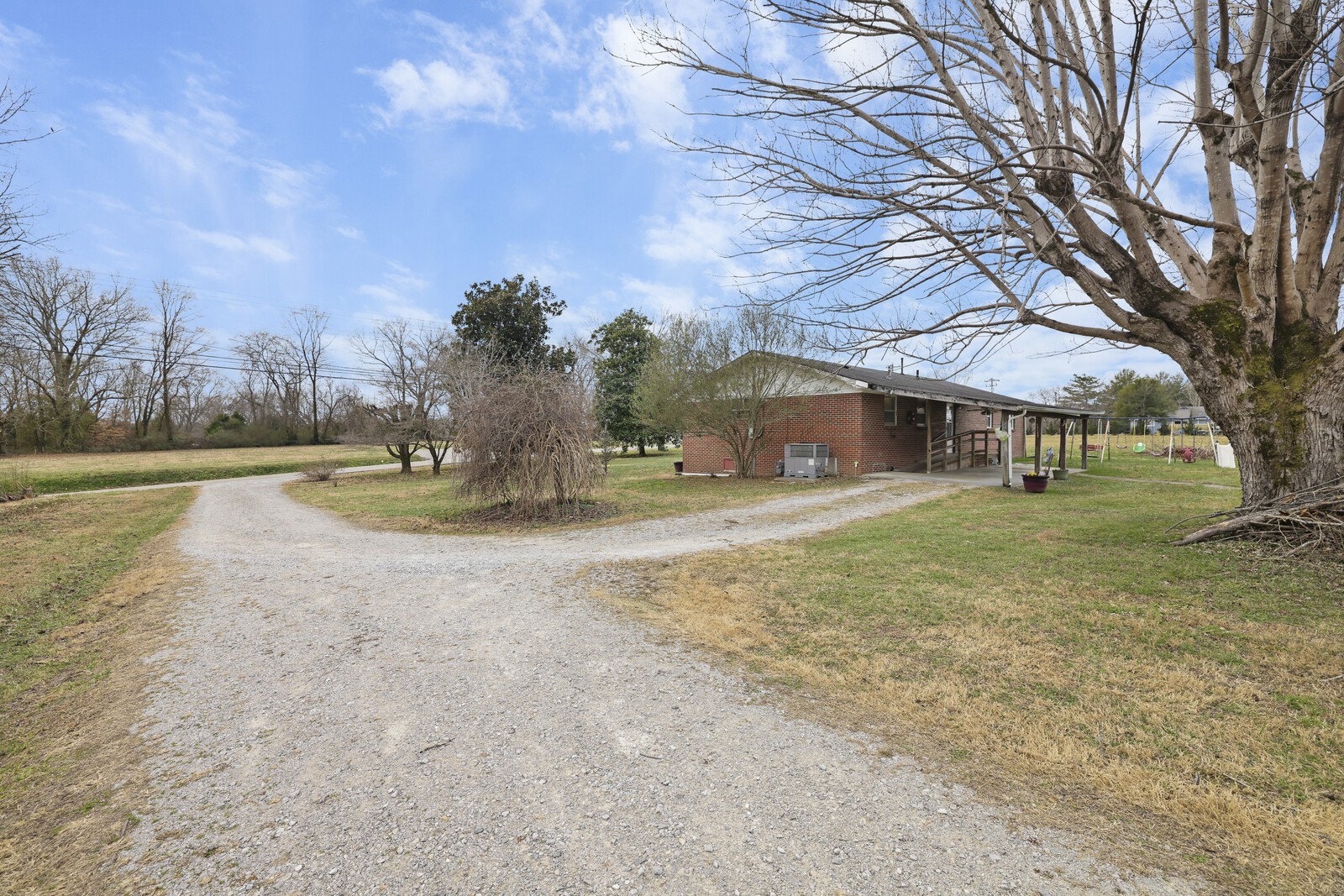 95 Pike Hill Road McMinnville, TN 37110 - Photo 19 of 42 a view of a house with a yard covered in snow
