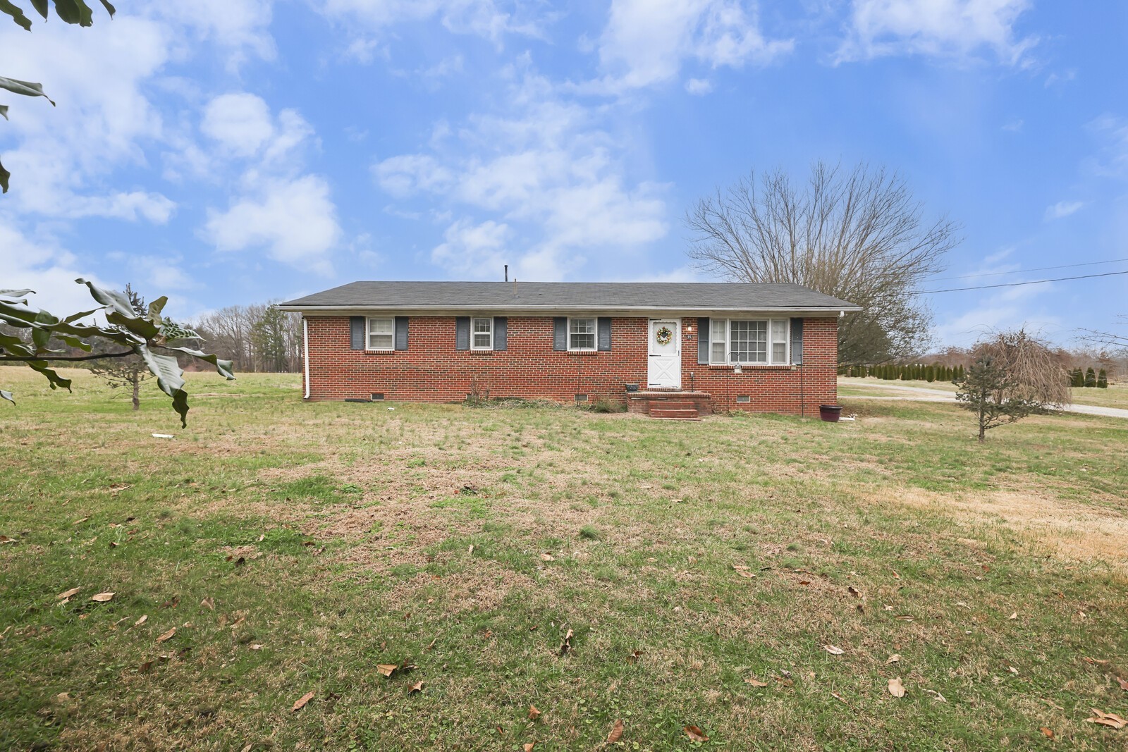 95 Pike Hill Road McMinnville, TN 37110 - Photo 3 of 42 a front view of a house with a yard
