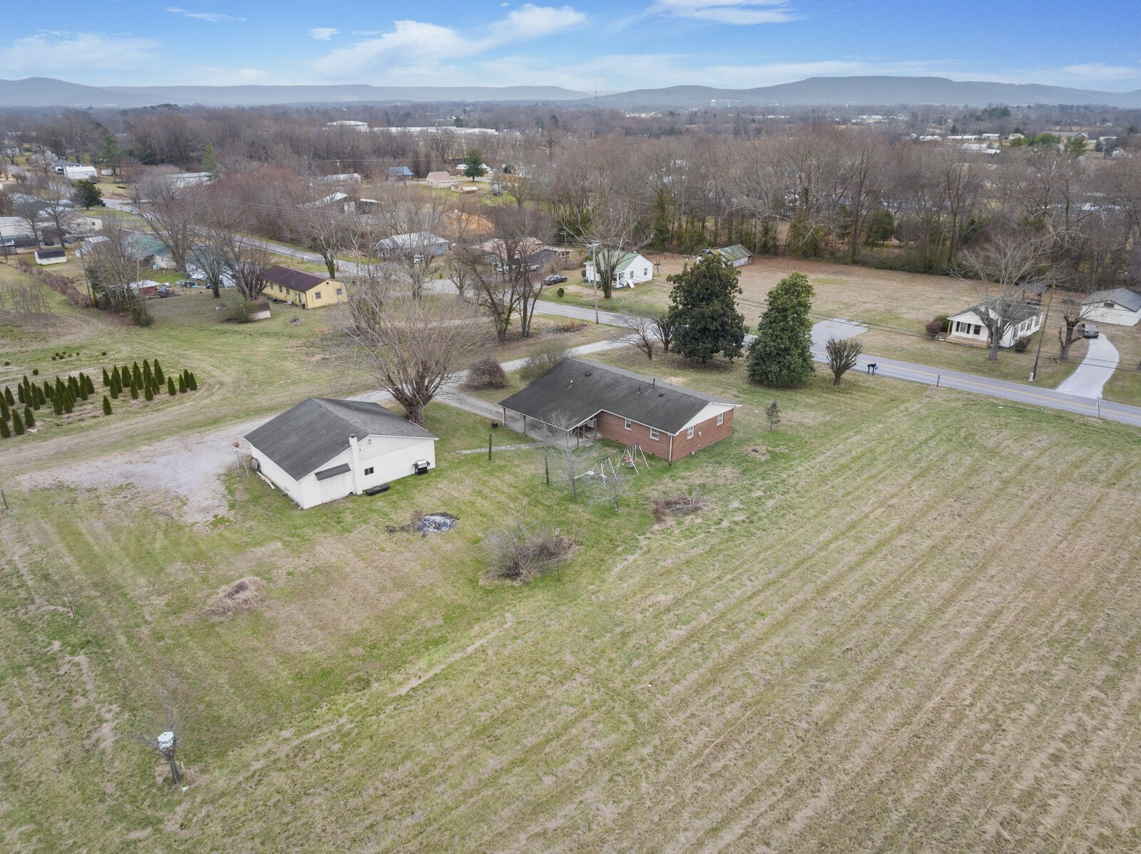 95 Pike Hill Road McMinnville, TN 37110 - Photo 36 of 42 an aerial view of residential houses with outdoor space and trees