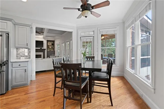 a living room with furniture or wooden floor and a large window