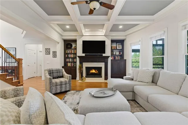 a living room with couch and a wooden floor