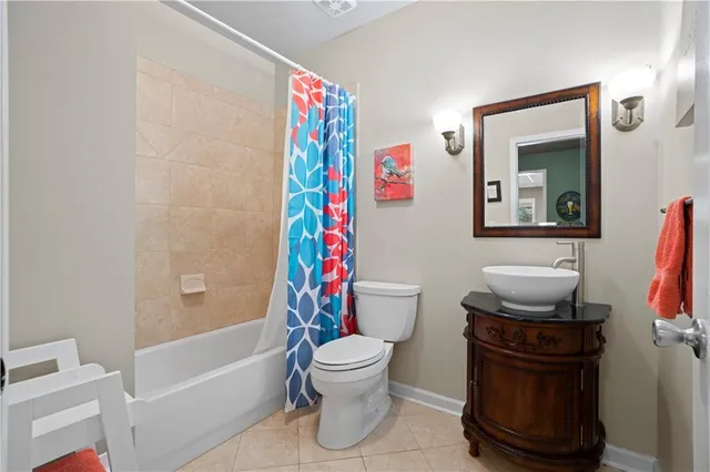 a bedroom with a bed and a flat screen television