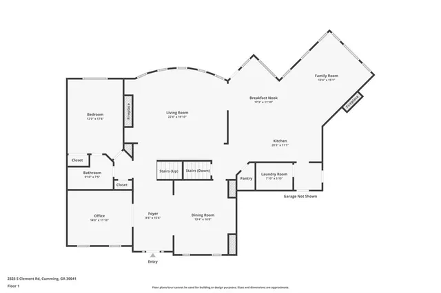 a view of a lake with a yard and large trees