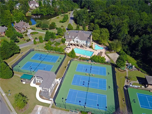 a aerial view of a house with a yard