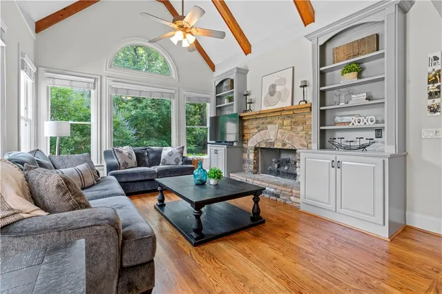 a large kitchen with kitchen island a large counter space a sink appliances and cabinets