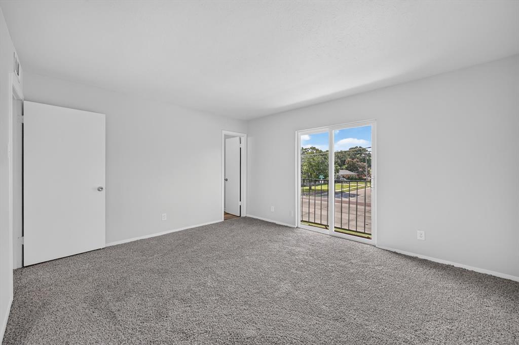 1801 East Grauwyler Road, Unit 101 Irving, TX 75061 - Photo 25 of 39 an empty room with windows