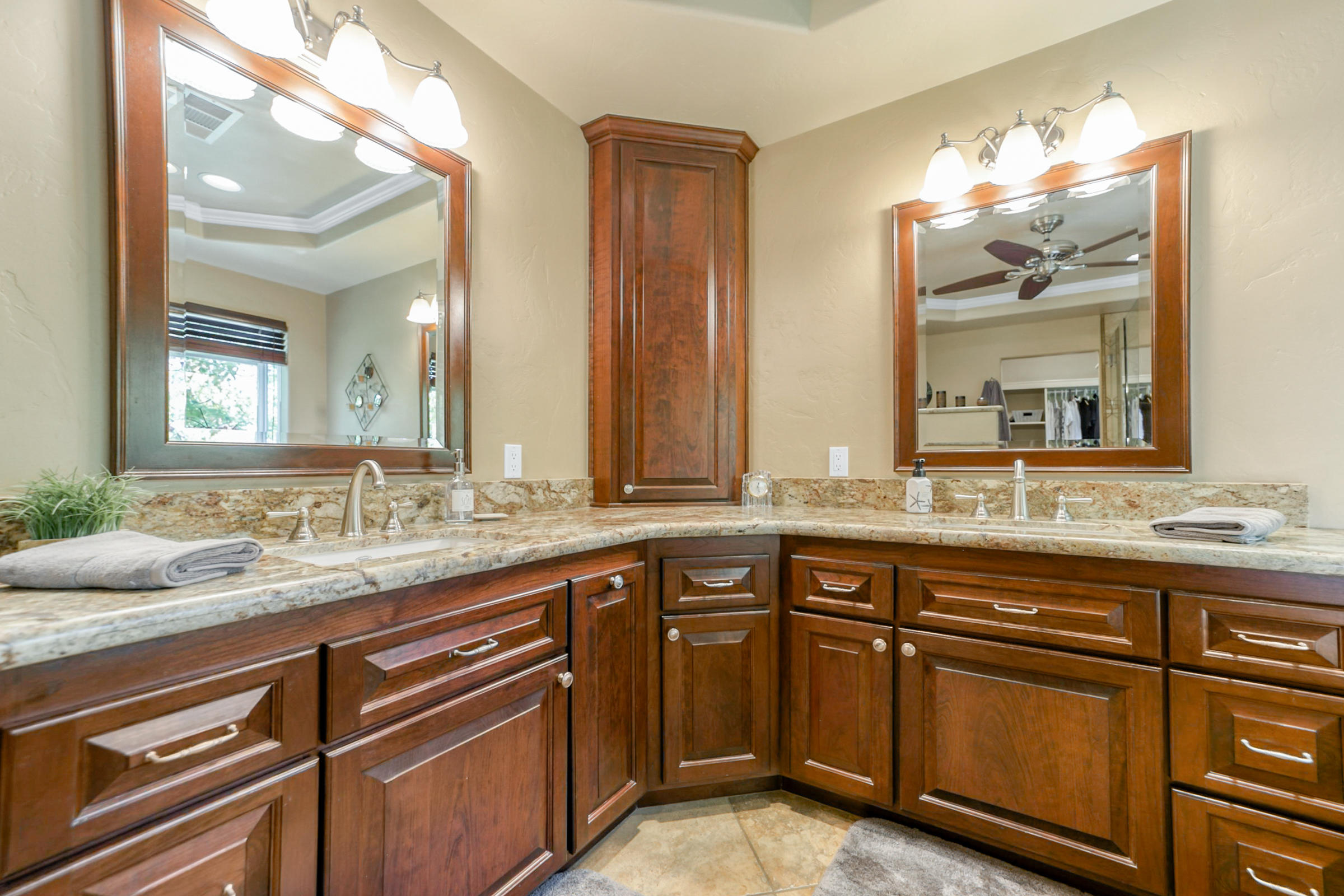 14385 Del Oro Court Red Bluff, CA 96080 - Photo 15 of 33 a bathroom with a granite countertop sink and a large mirror