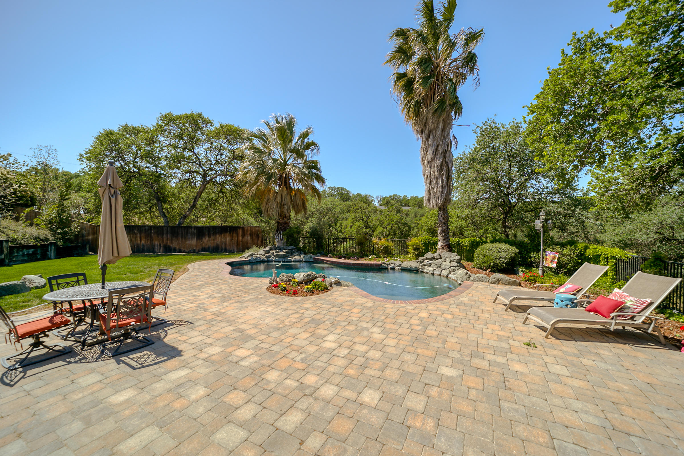 14385 Del Oro Court Red Bluff, CA 96080 - Photo 2 of 33 a view of a swimming pool with a lounge chair