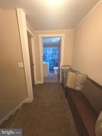 a living room with furniture and a gate