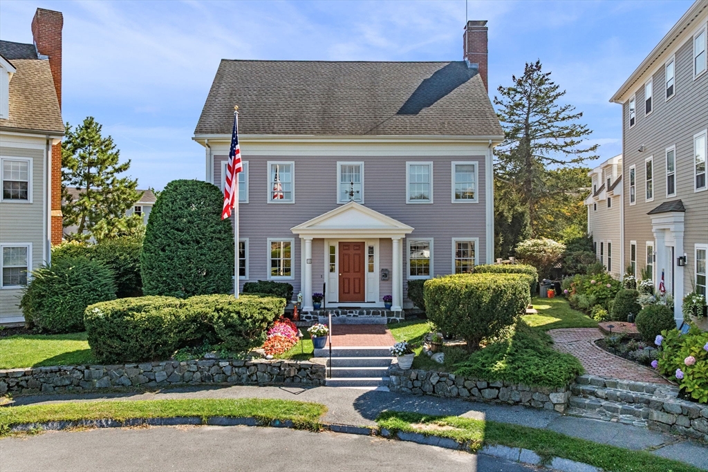 19 Doaks Lane Marblehead, MA 01945 - Photo 1 of 39 a front view of a house with a yard and potted plants