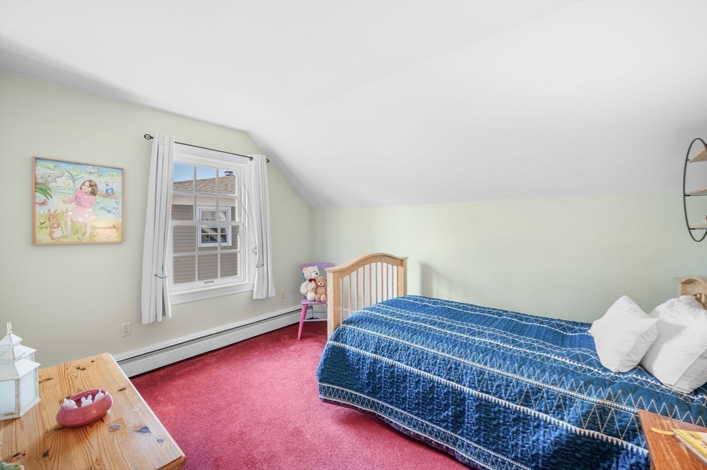 19 Doaks Lane Marblehead, MA 01945 - Photo 23 of 39 a bedroom with a bed and wooden floor