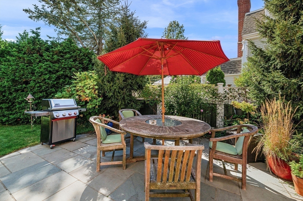 19 Doaks Lane Marblehead, MA 01945 - Photo 25 of 39 an outdoor space with furniture and umbrella
