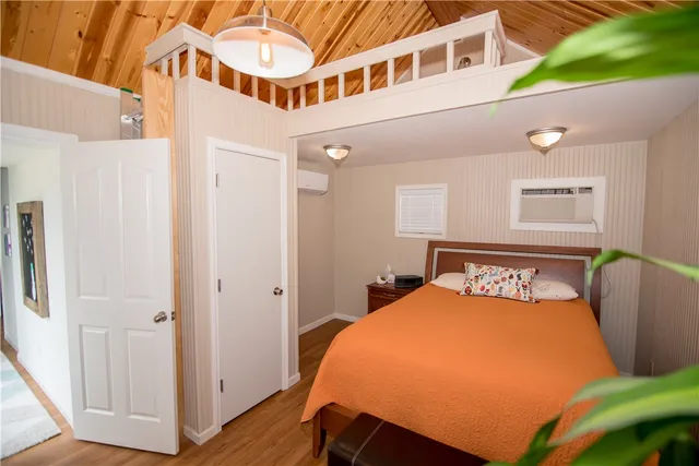 a bed room with a bed and a chair