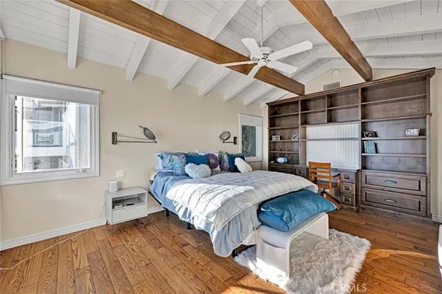 a bed room with a bed and a window