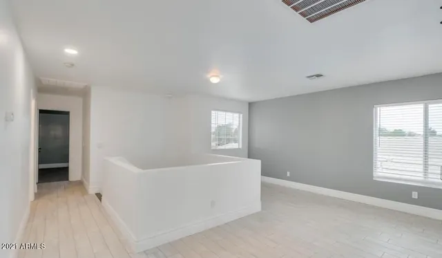 a view of an empty room with a window