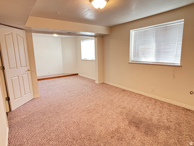 798 South 600 East Payson, UT 84651 - Photo 30 of 31 Spacious interior room featuring patterned carpeting and neutral wall paint