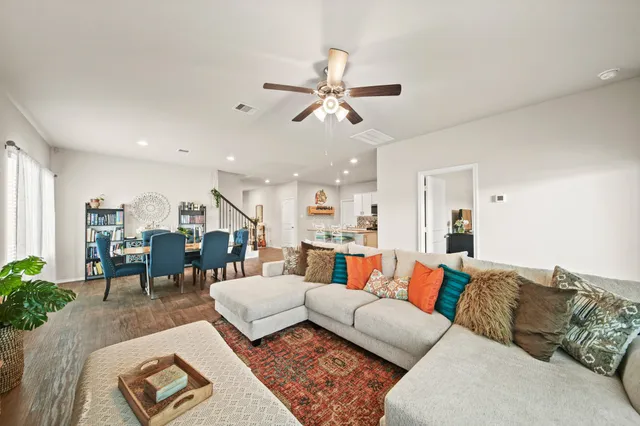 a living room with furniture and a rug
