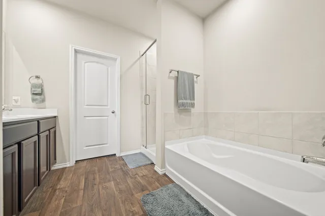 a bathroom with a bathtub and a sink