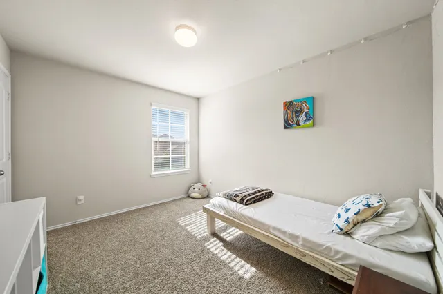 a living room with hard wood floor and furniture