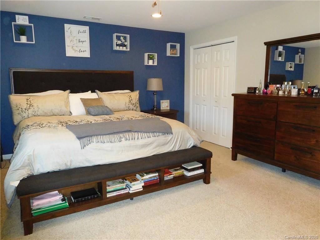 161 Cook Sears Road Gastonia, NC 28056 - Photo 14 of 31 a bed sitting in a bedroom and table