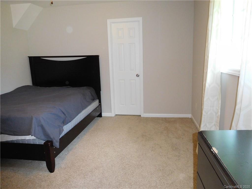 161 Cook Sears Road Gastonia, NC 28056 - Photo 17 of 31 a bedroom with a bed and a table