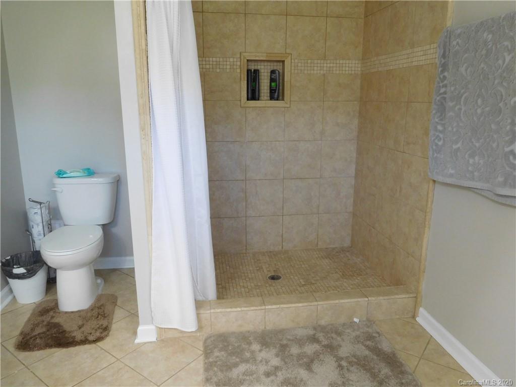 161 Cook Sears Road Gastonia, NC 28056 - Photo 18 of 31 a bathroom with a toilet and a shower