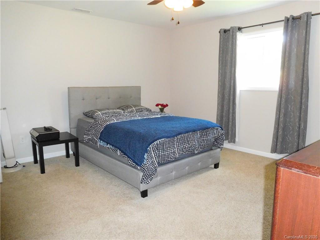 161 Cook Sears Road Gastonia, NC 28056 - Photo 20 of 31 a bedroom with a bed and a window