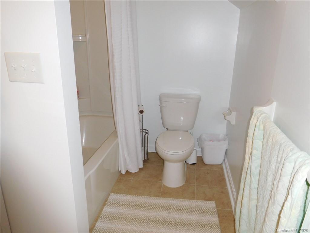 161 Cook Sears Road Gastonia, NC 28056 - Photo 27 of 31 a white toilet sitting next to a shower