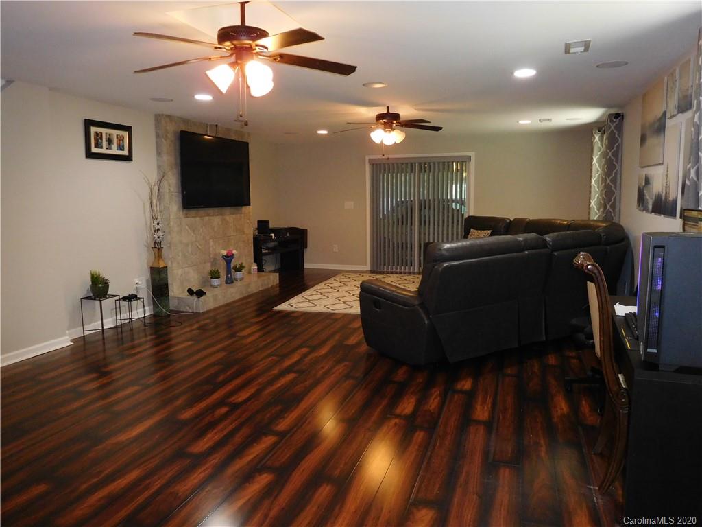 161 Cook Sears Road Gastonia, NC 28056 - Photo 4 of 31 a living room with furniture and a flat screen tv