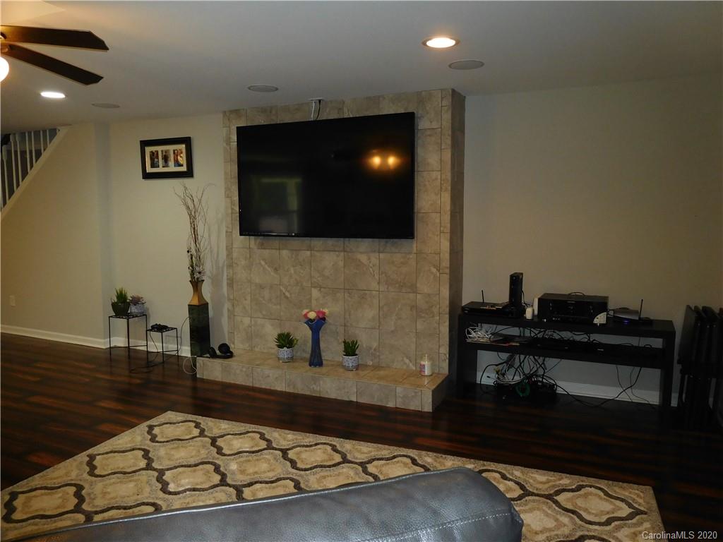 161 Cook Sears Road Gastonia, NC 28056 - Photo 5 of 31 a living room with furniture and a flat screen tv