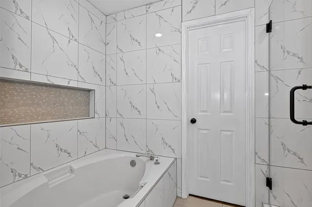 a bathroom with double sink and a mirror