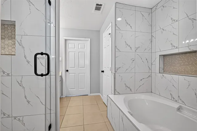 a bathroom with a shower and a sink