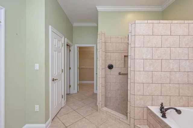 a bathroom with a bathtub and shower