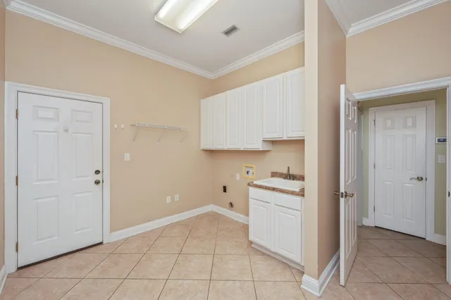 a kitchen with white cabinets and a stove