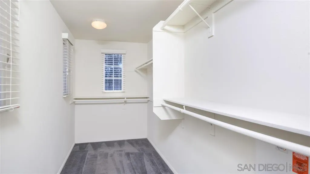 12 Night Bloom Irvine, CA 92602 - Photo 11 of 25 a view of an empty room with wooden floor and a window