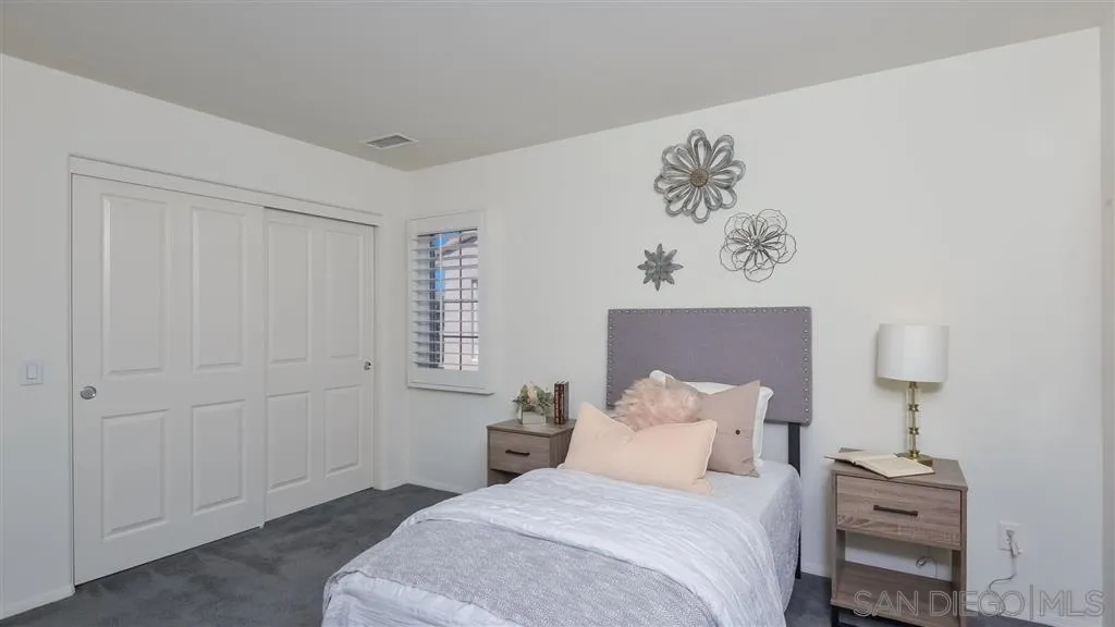 12 Night Bloom Irvine, CA 92602 - Photo 13 of 25 a bedroom with a bed and a painting on the wall