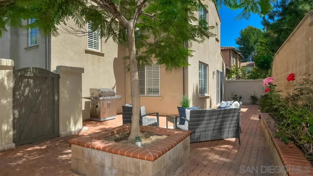 12 Night Bloom Irvine, CA 92602 - Photo 22 of 25 a view of an house with backyard and sitting area